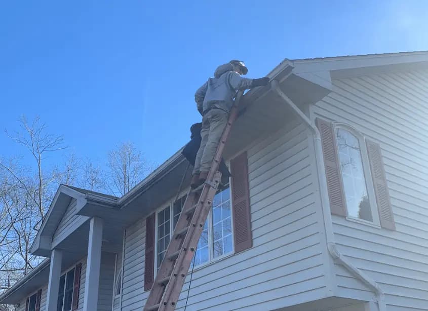 Gutter cleaning and maintenance being performed by Avon Lake Power Washing in Avon Lake